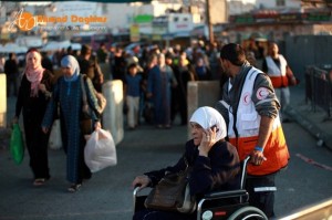 Palestinians cue at the Qalandiya checkpoint from five in the morning